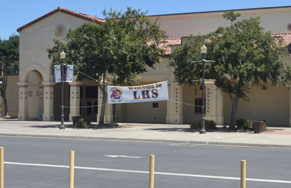 Lemoore High School's "Welcome Banner" stands alone in the school's student parking lot.